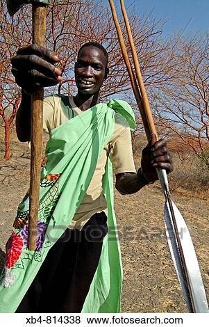 Stock Photo - Fashoda is the seige of king of Shilluk, shepherd with spears, Sudan. Fotosearch