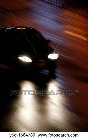 fast car driving in heavy rain at night in town View Large Photo Image Stock Image - fast car driving in heavy rain at night in town. Fotosearch