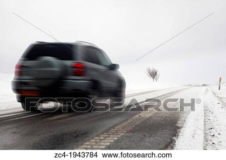 Fast car on snowy winter road. View Large Photo Image Picture - Fast car on snowy winter road.. Fotosearch