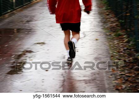 fast man runner on country lane View Large Photo Image Picture - fast man runner on country lane. Fotosearch