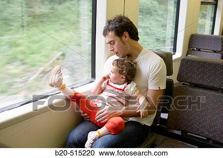 Father (35 years old) and daughter (2 years old) travelling in tramway. View Large Photo Image Stock Image - Father (35 years old) and daughter (2 years old) travelling in tramway.. Fotosearch