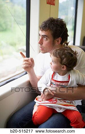 Father (35 years old) and daughter (2 years old) travelling in tramway. View Large Photo Image Stock Photo - Father (35 years old) and daughter (2 years old) travelling in tramway.. Fotosearch