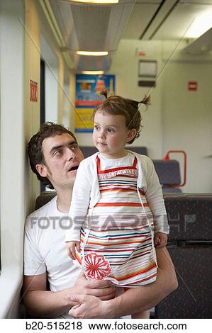 Father (35 years old) and daughter (2 years old) travelling in tramway. View Large Photo Image Stock Photo - Father (35 years old) and daughter (2 years old) travelling in tramway.. Fotosearch