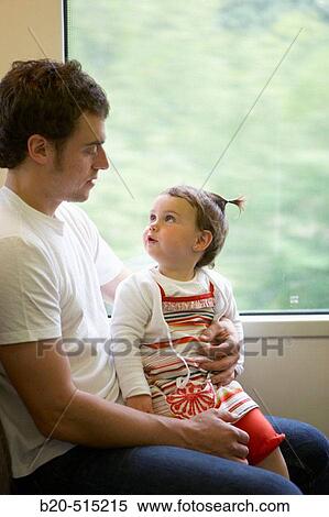 Father (35 years old) and daughter (2 years old) travelling in tramway. View Large Photo Image Stock Photography - Father (35 years old) and daughter (2 years old) travelling in tramway.. Fotosearch