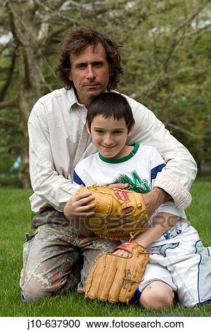 Father (age 48) & son (age 11), with baseball gloves, Poughkeepsie, New York. USA. View Large Photo Image Stock Image - Father (age 48) & son (age 11), with baseball gloves, Poughkeepsie, New York. USA.. Fotosearch