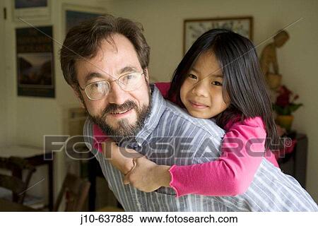 Father and adopted daughter (Vietnam) age 8, Poughkeepsie, NY. USA. View Large Photo Image Stock Photography - Father and adopted daughter (Vietnam) age 8, Poughkeepsie, NY. USA.. Fotosearch