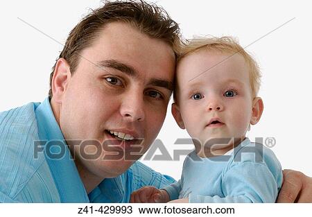 Father and baby looking into the camera View Large Photo Image Stock Image - Father and baby looking into the camera. Fotosearch