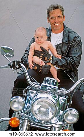 Father and baby on motorbike View Large Photo Image Stock Image - Father and baby on motorbike. Fotosearch
