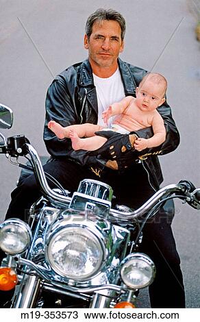 Father and baby on motorbike View Large Photo Image Stock Image - Father and baby on motorbike. Fotosearch