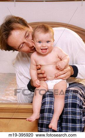 Stock Image - father and baby. Fotosearch