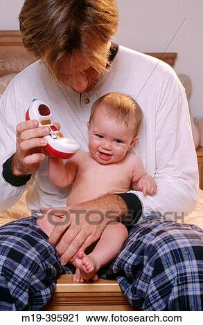 Stock Image - father and baby. Fotosearch