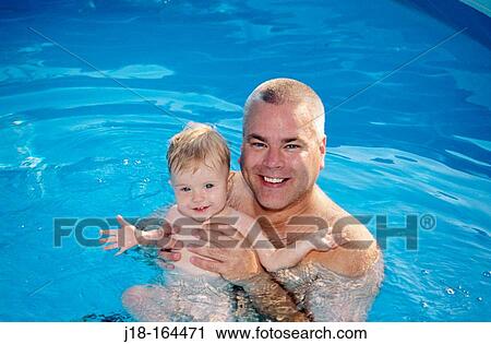 Father and child in swimming pool View Large Photo Image Stock Image - Father and child in swimming pool. Fotosearch