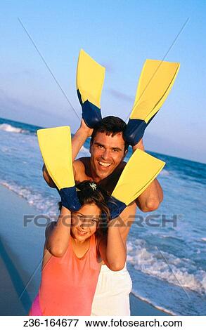Father and daughter at the beach View Large Photo Image Stock Photo - Father and daughter at the beach. Fotosearch
