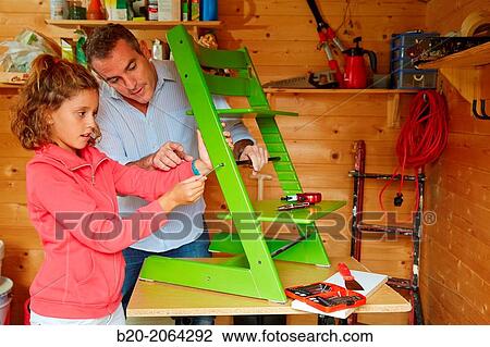 Father and daughter doing DIY. Assembling a chair. View Large Photo Image Stock Image - Father and daughter doing DIY. Assembling a chair.. Fotosearch