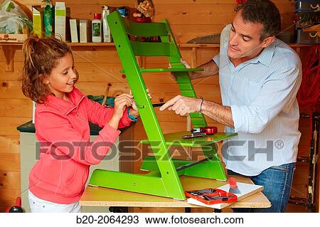 Father and daughter doing DIY. Assembling a chair. View Large Photo Image Stock Image - Father and daughter doing DIY. Assembling a chair.. Fotosearch
