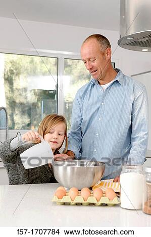 Father and daughter in the kitchen View Large Photo Image Picture - Father and daughter in the kitchen. Fotosearch