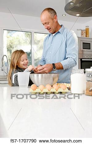 Father and daughter in the kitchen View Large Photo Image Stock Image - Father and daughter in the kitchen. Fotosearch