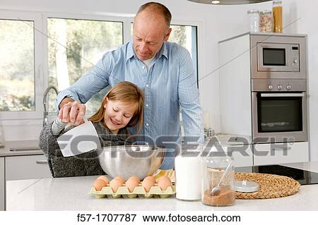 Stock Photo - Father and daughter in the kitchen. Fotosearch