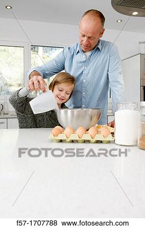 Father and daughter in the kitchen View Large Photo Image Stock Photo - Father and daughter in the kitchen. Fotosearch
