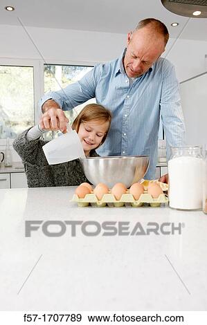 Father and daughter in the kitchen View Large Photo Image Stock Photo - Father and daughter in the kitchen. Fotosearch