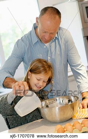 Father and daughter in the kitchen View Large Photo Image Stock Photo - Father and daughter in the kitchen. Fotosearch