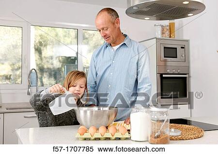 Father and daughter in the kitchen View Large Photo Image Stock Photography - Father and daughter in the kitchen. Fotosearch