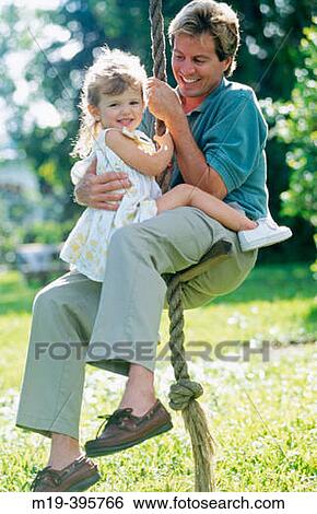 father and daughter on a rope swing View Large Photo Image Stock Photograph - father and daughter on a rope swing. Fotosearch