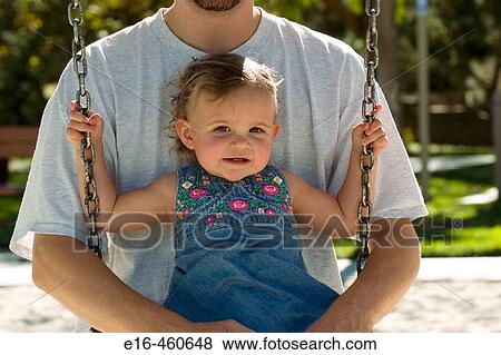 Father and daughter on swing View Large Photo Image Stock Photo - Father and daughter on swing. Fotosearch