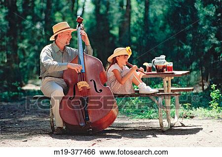 father and daughter playing music in the woods View Large Photo Image Stock Photograph - father and daughter playing music in the woods. Fotosearch