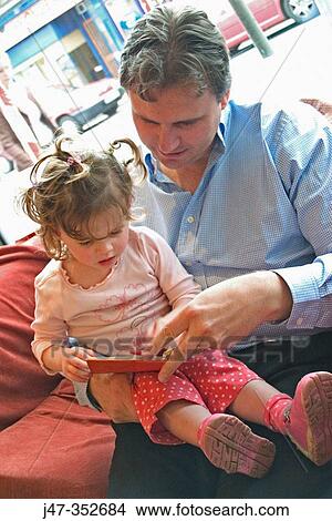 Father and daughter reading View Large Photo Image Picture - Father and daughter reading. Fotosearch