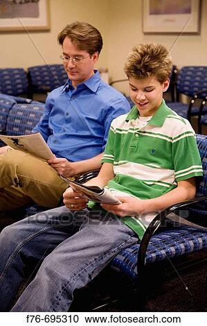Father and his 15 year old son reading while sitting in waiting room of doctor's office View Large Photo Image Stock Image - Father and his 15 year old son reading while sitting in waiting room of doctor's office. Fotosearch