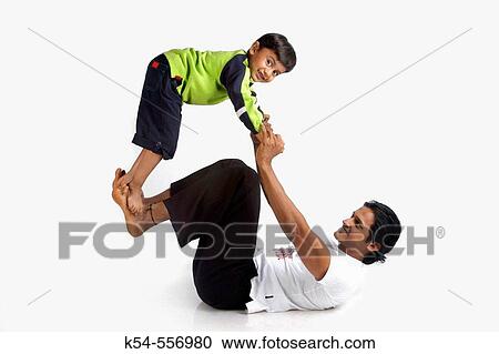 Father and his son enjoying a leasure time. View Large Photo Image Stock Image - Father and his son enjoying a leasure time.. Fotosearch