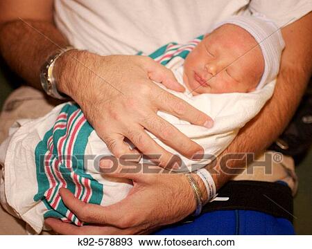 Stock Image - Father and newborn baby. Fotosearch