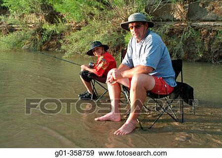 Father and son fishing the Green River in Utah, USA View Large Photo Image Stock Photo - Father and son fishing the Green River in Utah, USA. Fotosearch