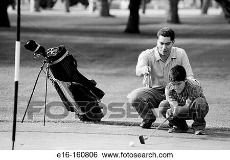 Father and son golfing View Large Photo Image Stock Photograph - Father and son golfing. Fotosearch
