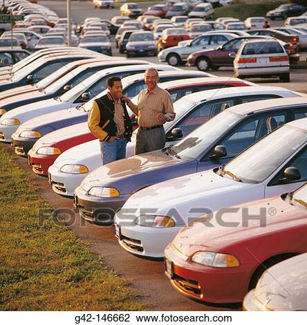Stock Image - Father and son. New car purchase. Fotosearch