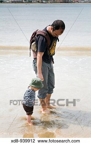 father and son on the beach View Large Photo Image Stock Image - father and son on the beach. Fotosearch