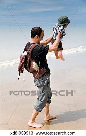 father and son on the beach View Large Photo Image Stock Image - father and son on the beach. Fotosearch