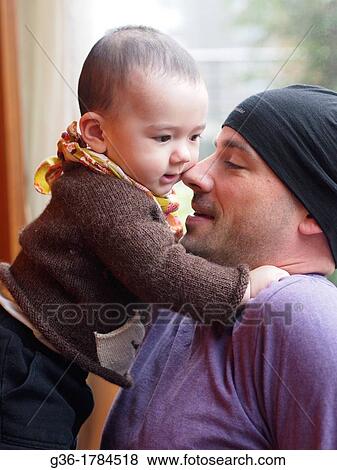 Stock Photo - Father and son play in Taipei, Taiwan. Fotosearch