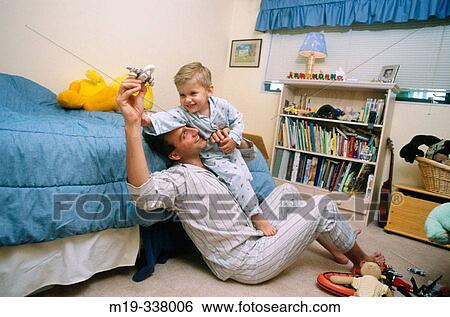 Father and son playing View Large Photo Image Stock Photograph - Father and son playing. Fotosearch