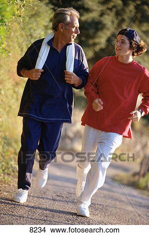 Father and son running View Large Photo Image Picture - Father and son running. Fotosearch