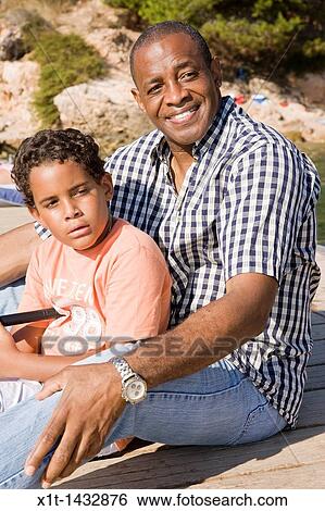 Father and son. View Large Photo Image Stock Photograph - Father and son.. Fotosearch