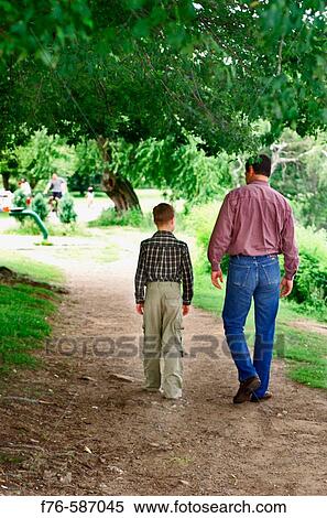 Father and son walking and talking. View Large Photo Image Stock Photography - Father and son walking and talking.. Fotosearch
