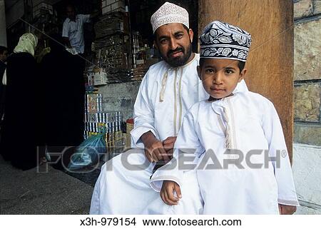 father and son wearing skullcap, Muscat, Sultanate of Oman, Arabian Peninsula, Asia View Large Photo Image Picture - father and son wearing skullcap, Muscat, Sultanate of Oman, Arabian Peninsula, Asia. Fotosearch