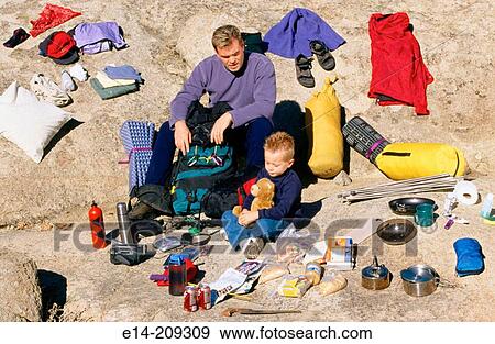 Father and son with camping gear spread out. Utah. USA View Large Photo Image Stock Photo - Father and son with camping gear spread out. Utah. USA. Fotosearch