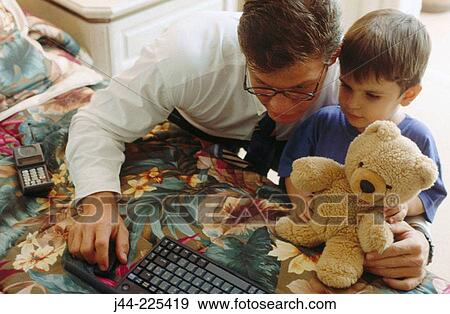 Father and son working with laptop computer View Large Photo Image Stock Photo - Father and son working with laptop computer. Fotosearch