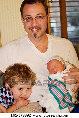 Father and three-year-old son and two-day-old son. View Large Photo Image Stock Image - Father and three-year-old son and two-day-old son.. Fotosearch