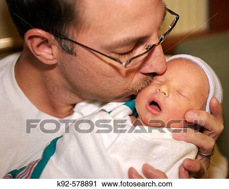 Stock Image - Father and two day old infant. Fotosearch