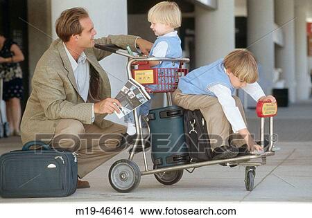 father at the airport with two sons View Large Photo Image Picture - father at the airport with two sons. Fotosearch