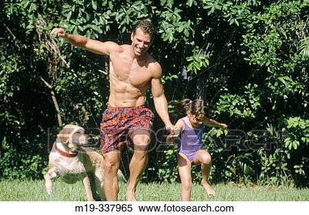 Father daughter and dog playing with sprinklers View Large Photo Image Stock Photography - Father daughter and dog playing with sprinklers. Fotosearch